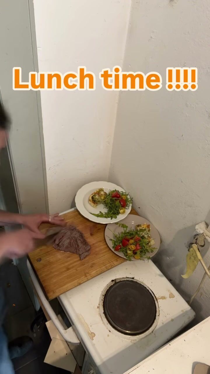 Lunch on a chopping board beside a hot plate