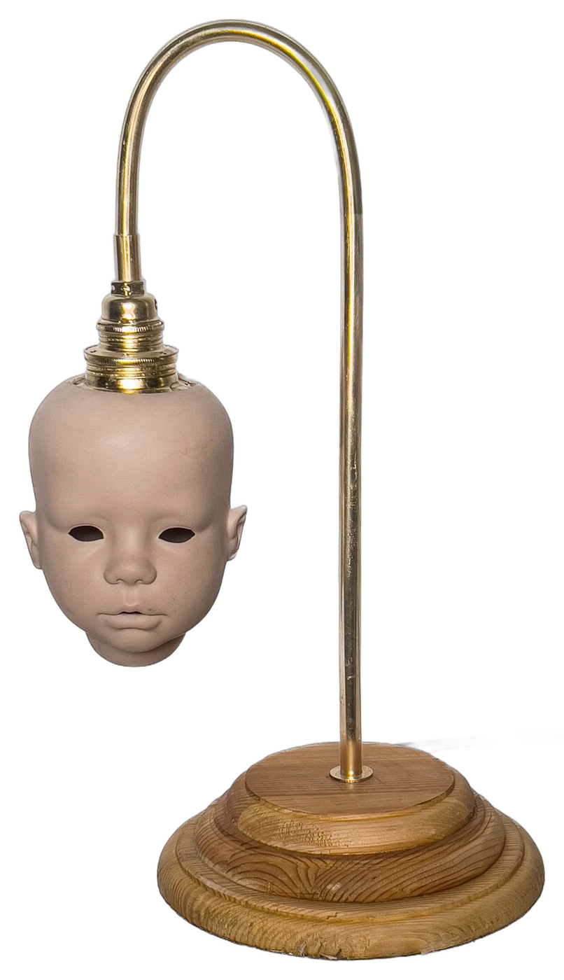 Creepy Baby Lamp in the studio, switched off