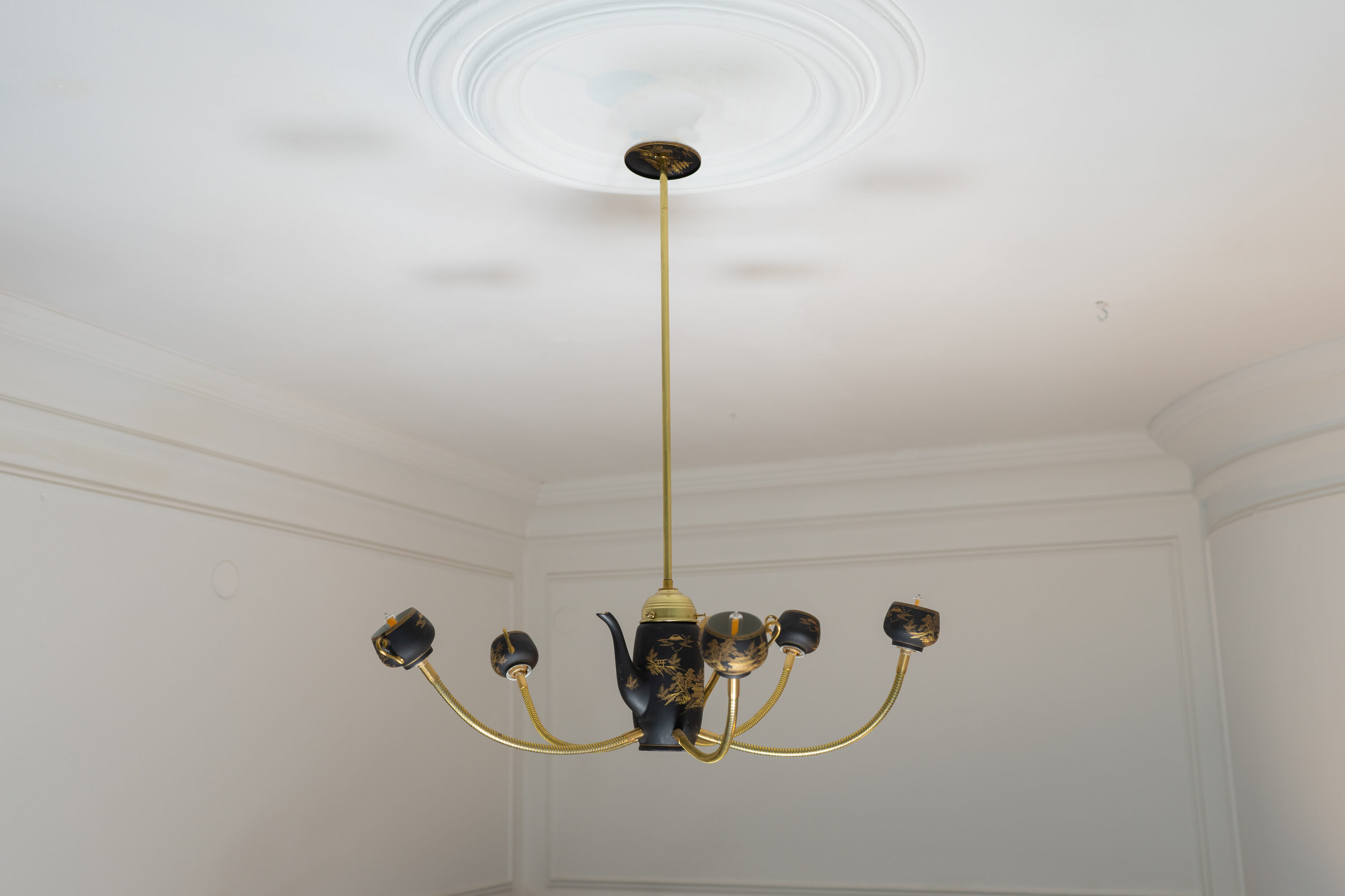 The Empress hanging from a ceiling rose, seen from below