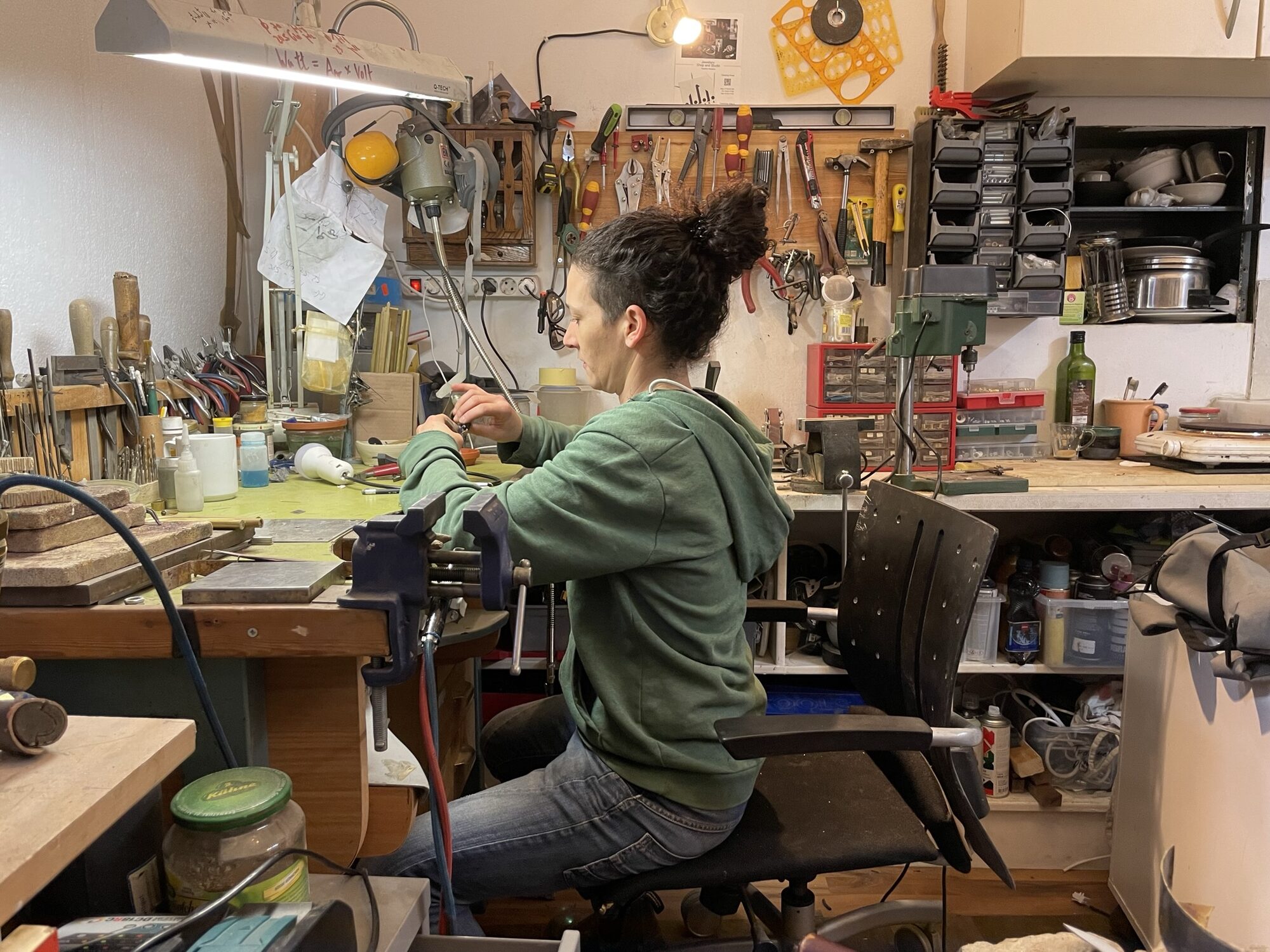 Keren at her jeweller's bench in the studio at Frankfurter Allee 6, working on a piece