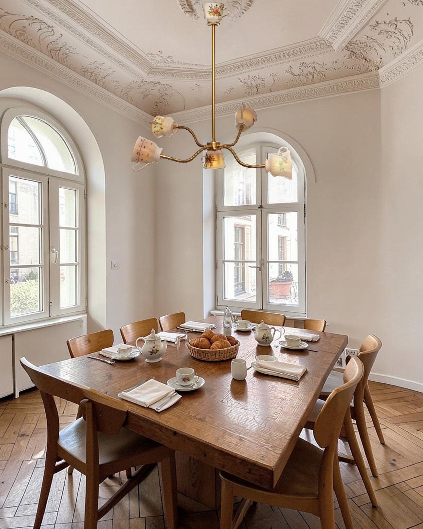 Tea Party, the teacup chandelier, over a breakfast table in an Altbau room with tall windows