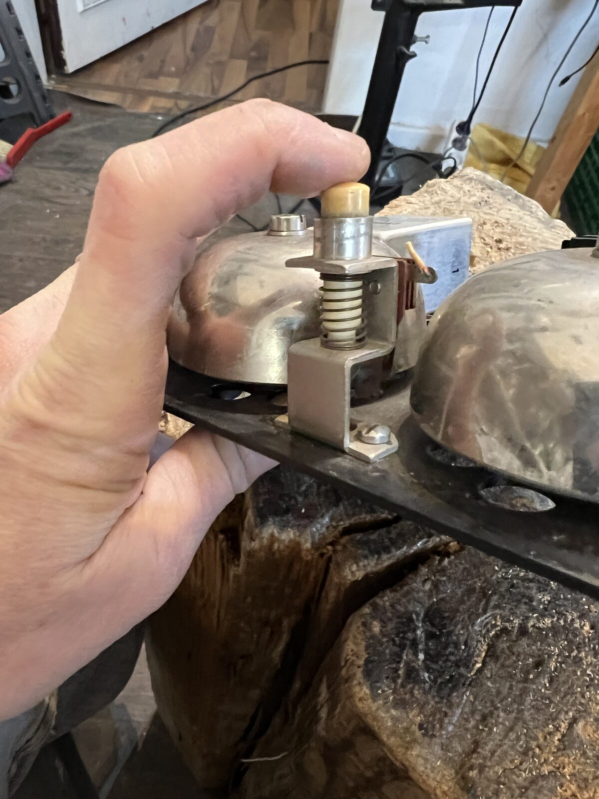 Keren's hands fitting the switch between the bells on the stump