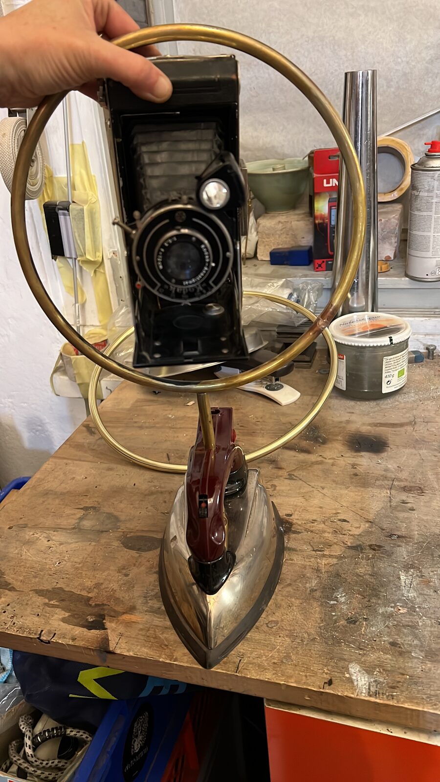 Keren holding the brass ring over the iron and camera, mock-up