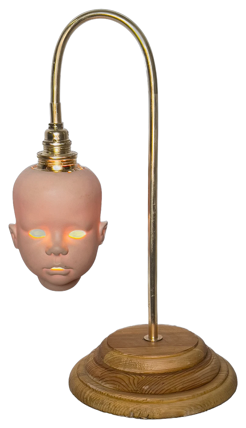 Creepy Baby Lamp, Once a porcelain doll's head, now a table lamp.