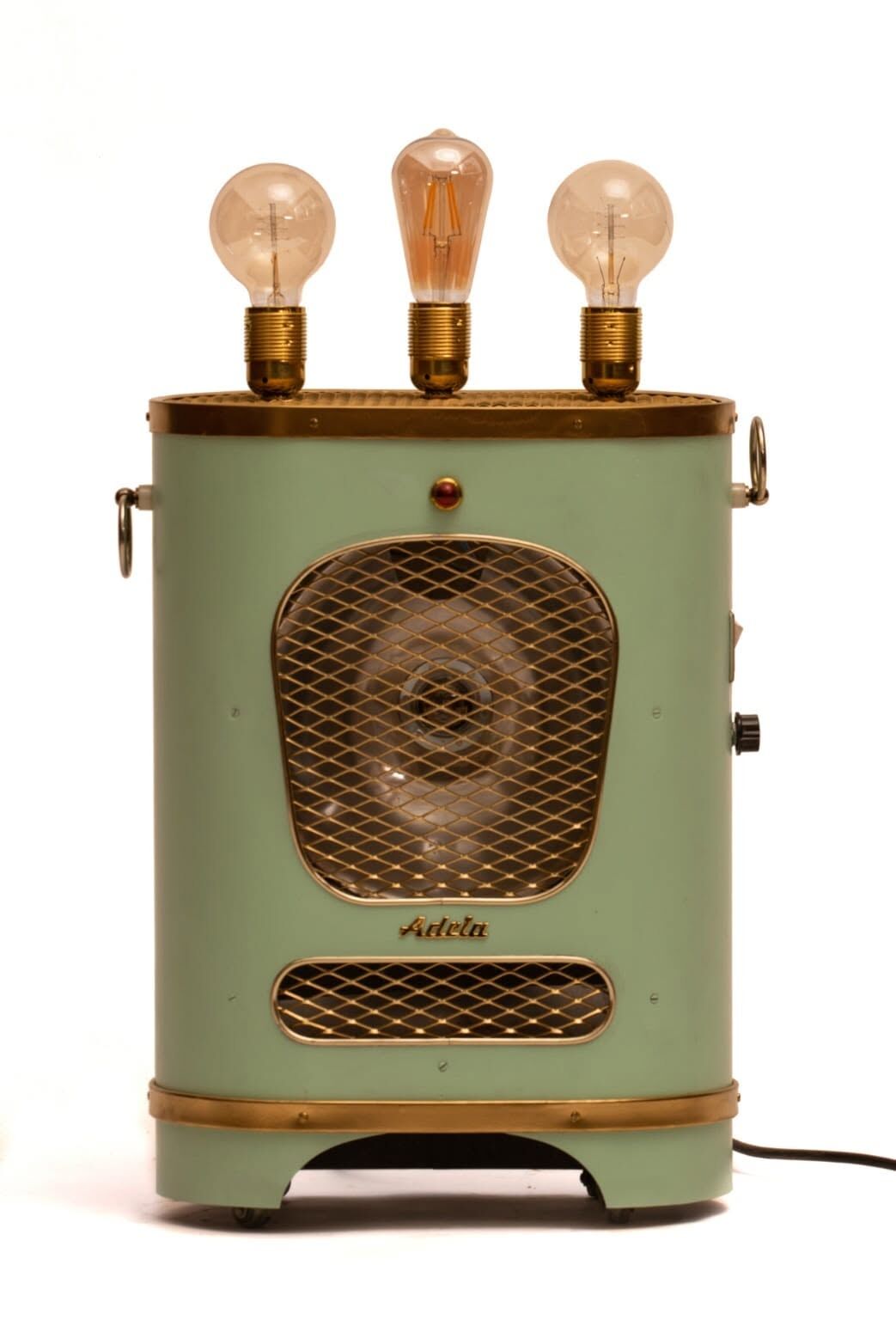 The finished Green Heater on a white ground, lit, three bulbs on top