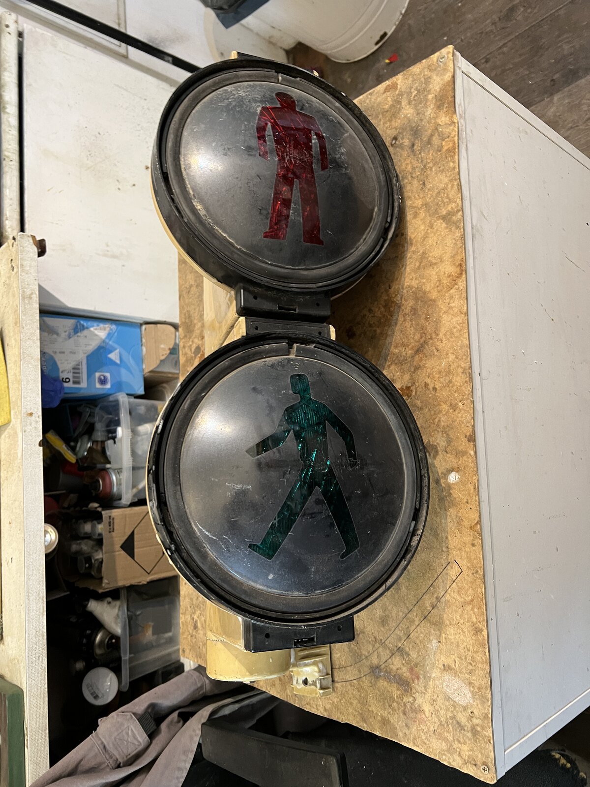 The traffic light opened: the red and green lenses on the bench.