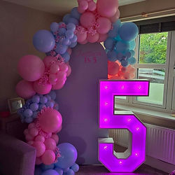 Light-up number display with personalised sailboard and balloon styling for a milestone birthday