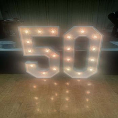 Light-up number 50 display with warm white bulbs — ideal for wedding anniversary celebrations and milestone events.