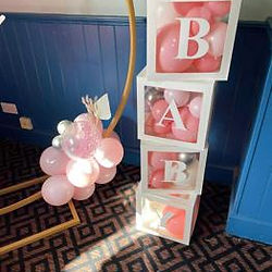Stacked BABY balloon boxes with balloons in pastel colours for a baby shower in Ripley, Derbyshire.