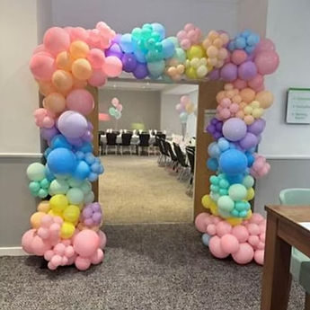 pastel coloured balloon arch