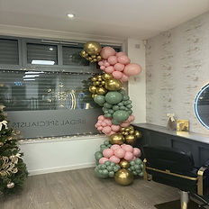 Pink, sage and gold fixed balloon garland installed in a Hairdressers in Ripley