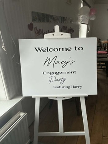 Personalised engagement welcome sign on easel at celebration venue