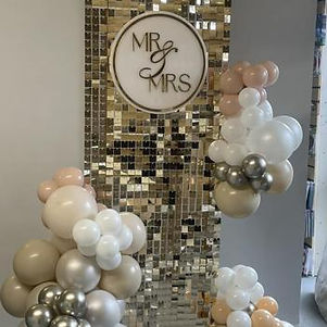 Elegant Mr & Mrs sequin wall backdrop with balloon styling — perfect for weddings
