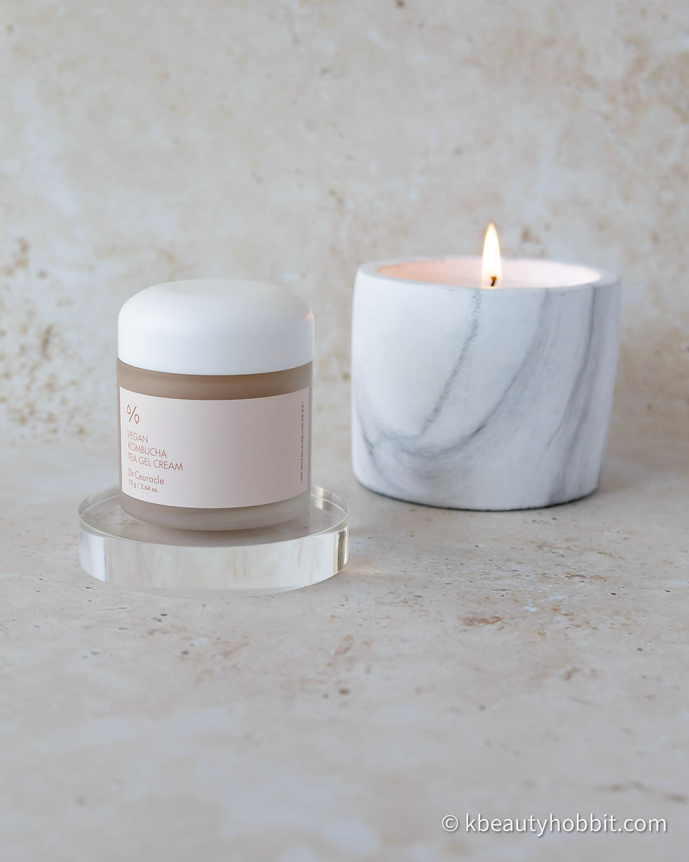 Dr. Ceuracle Vegan Kombucha Tea Gel Cream next to a candle