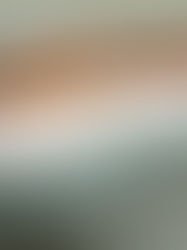 White pillows on a wooden bed with teal bedding. Text reads "SLEEP & GLOW: Omnia vs Aula pillows." Calm, neutral setting.