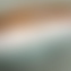 White pillows on a wooden bed with teal bedding. Text reads "SLEEP & GLOW: Omnia vs Aula pillows." Calm, neutral setting.