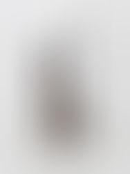 a brown tube of Romand mascara with the lid off and mascara wand clearly visible