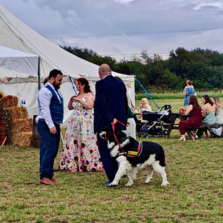 Nathan and Kirsty greeting guests at their wedding reception at BrackenXcapes
