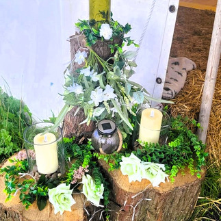 Rustic wedding decorations at the entrance to the marquee