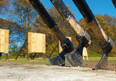 Axes ready to be thrown at wooden targets