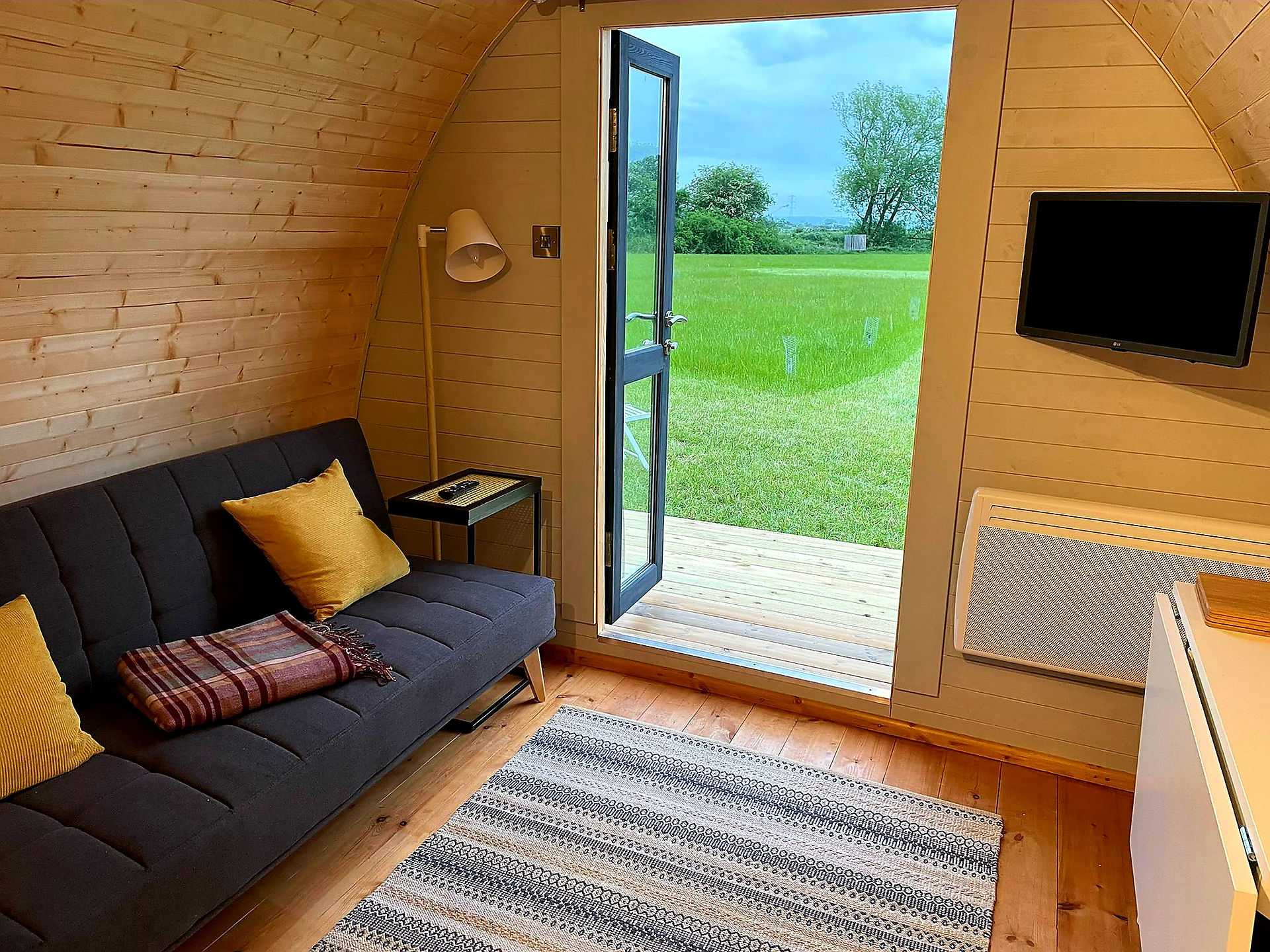 Glamping pod interior opening to the field at BrackenXcapes