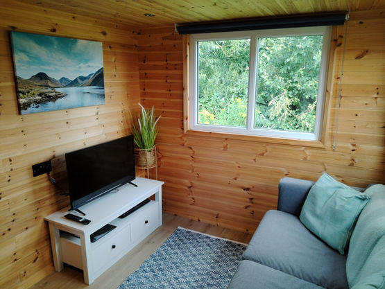 Bracken Heights lodge lounge with sofa and TV