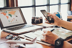 young-man-using-smartphone-planning-vacation-trip.jpg