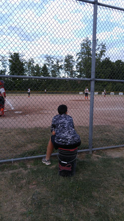 Coach Rouleau watching her 16U