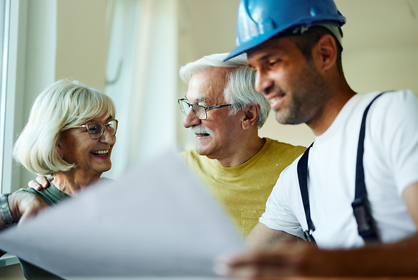 couple with builder discussing renovations