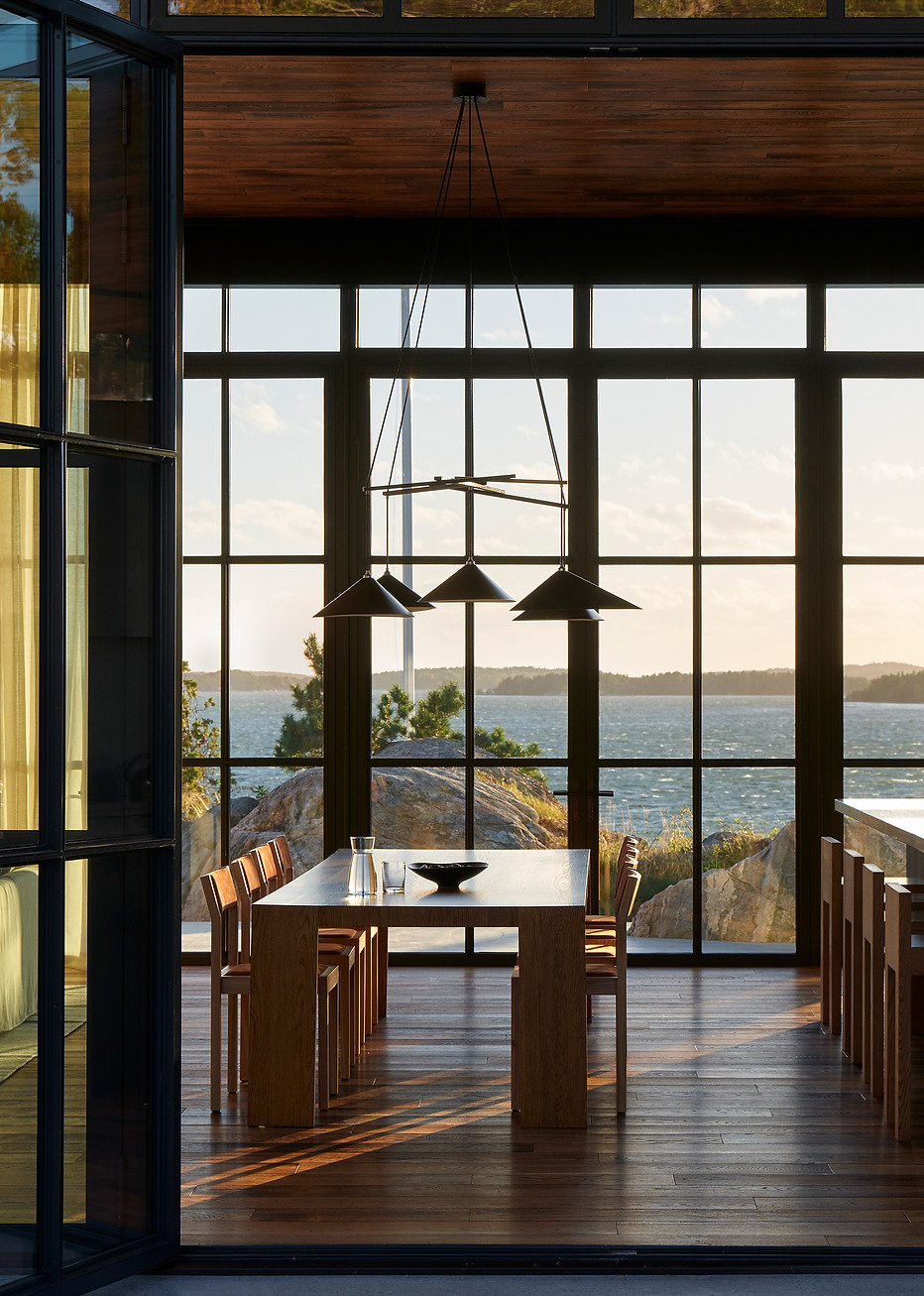Close interior view: Emily Group of Five casting warm ambient light over dining area.
