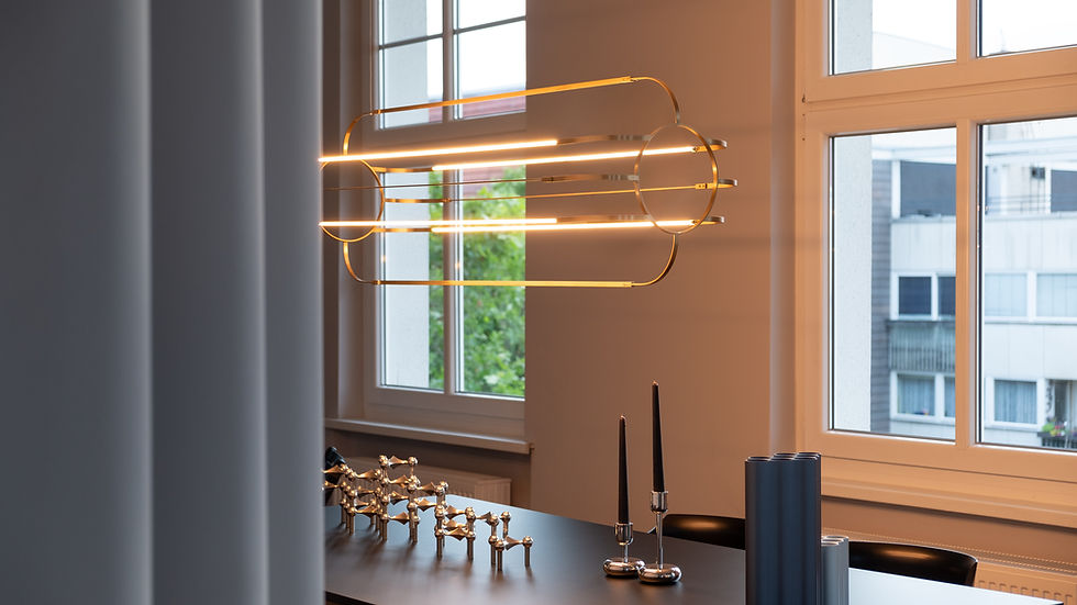 Eye-level view of a minimalist pendant light with integrated smart controls