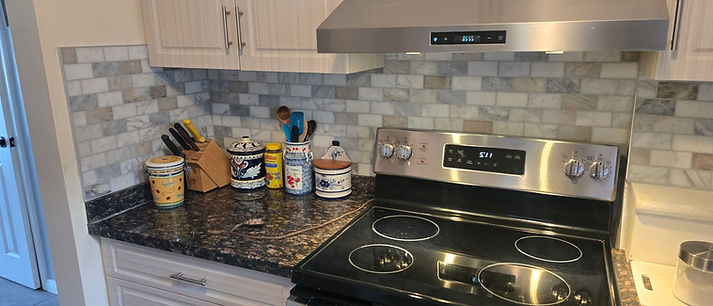 Renovated kitchen with updated cabinets and countertops