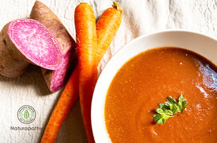 Vegan purple sweet potato and carrot ginger soup