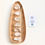 Thumbnail: selection of clear quartz displayed on a wood board