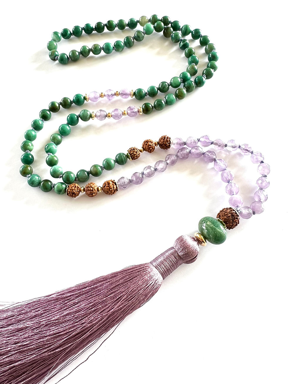 Thumbnail: detail of the mala beads closeup focusing on the rudraksha and moss agate guru beads
