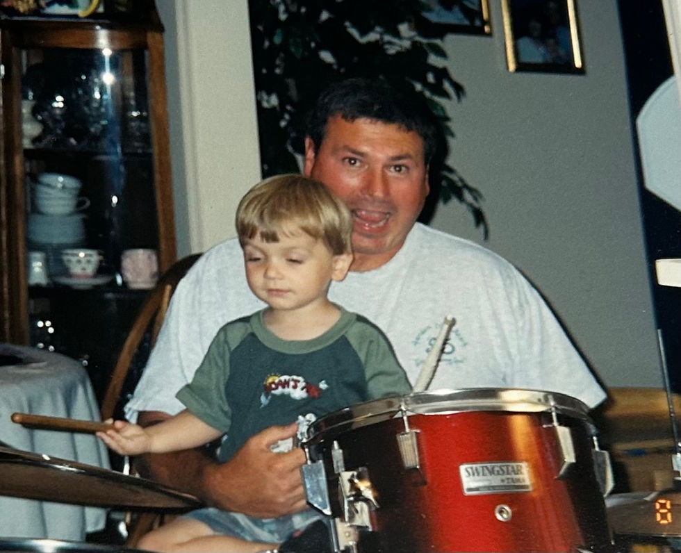 Norm brought drums over to our house one night so Joshua could play them - and Joshua did become a drummer!