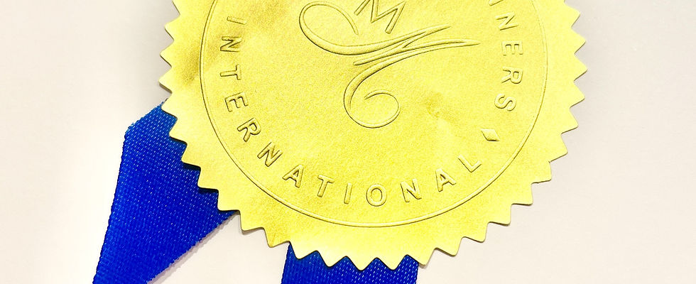 Minding Manners International gold certificate seal with blue ribbon