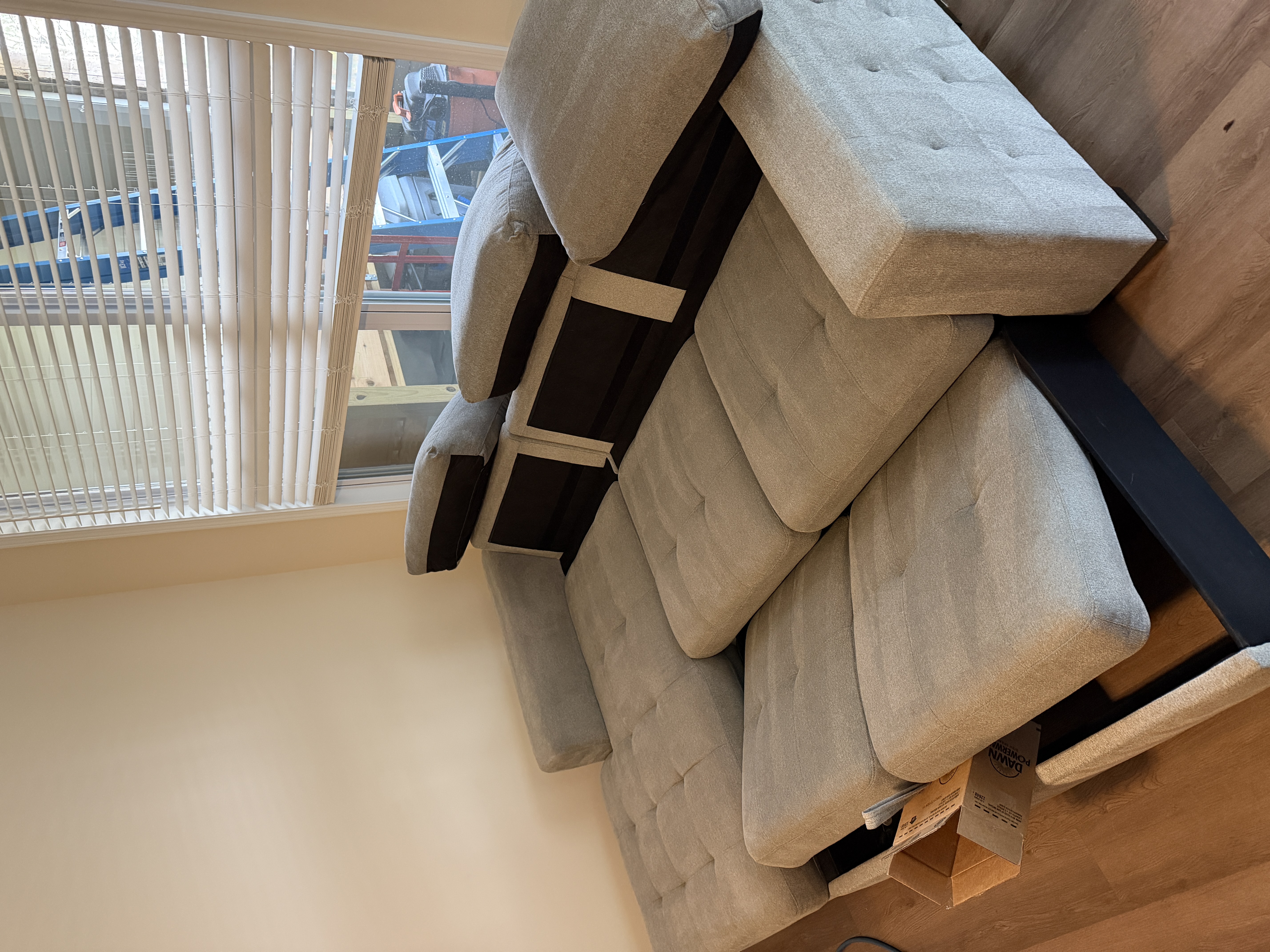 Modern grey modular sectional sofa with tufted cushions in Davidson, NC