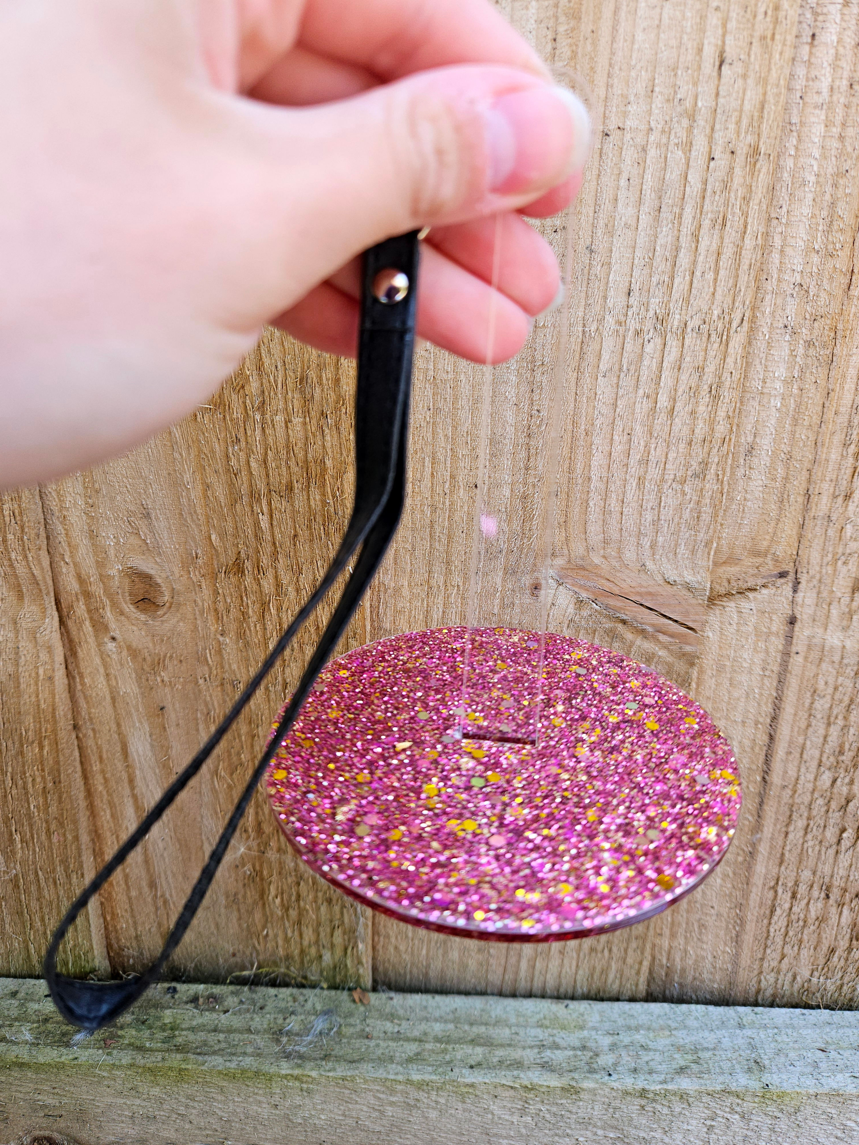 Handmade glitter/resin acrylic wrist yarn holder. Design h
