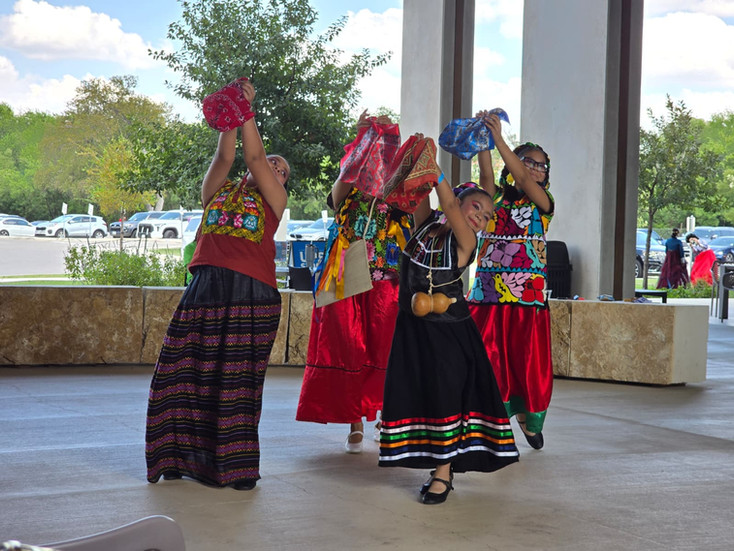 Young dancers from Art & Dance Studio performing traditional Mexican folklore in colorful costumes at the Around the World event in San Antonio.