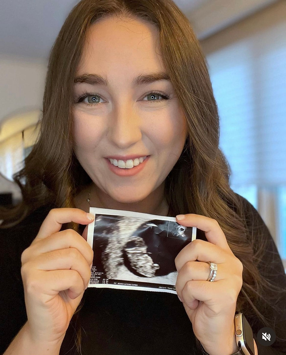 Woman holding sonogram