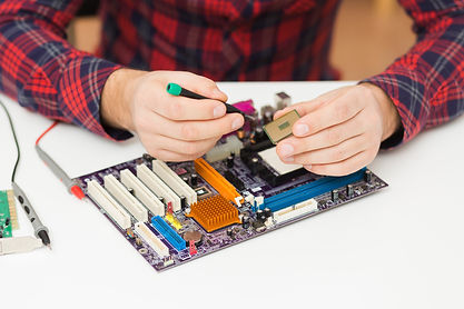 close-up-person-repairing-motherboard.jpg