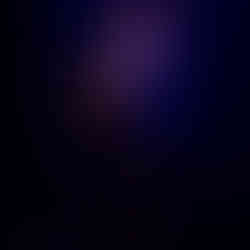 Paul Dempsey standing alone in a white spotlight, singing into a microphone while strumming an acoustic guitar before the glorious QPAC Concert Hall