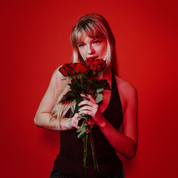 Abi Muir smelling roses