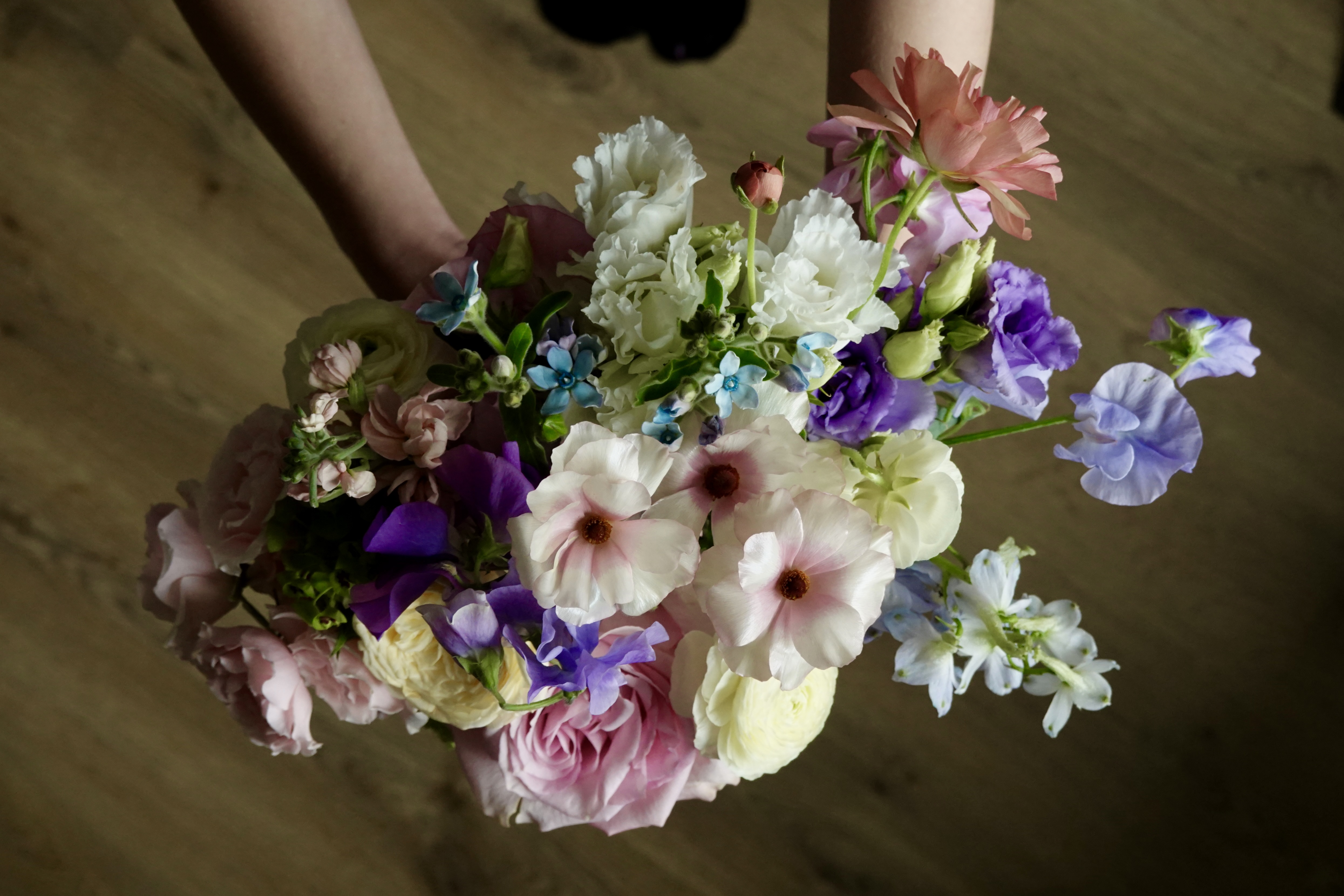 Pastel floral arrangement beside a mirror