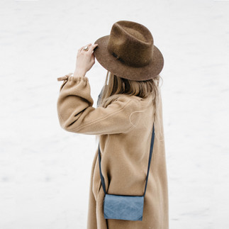 woman wearing coat and hat