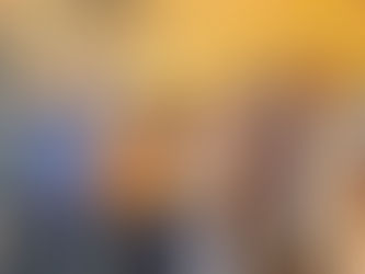 Generations of a family walking together in a park in fall