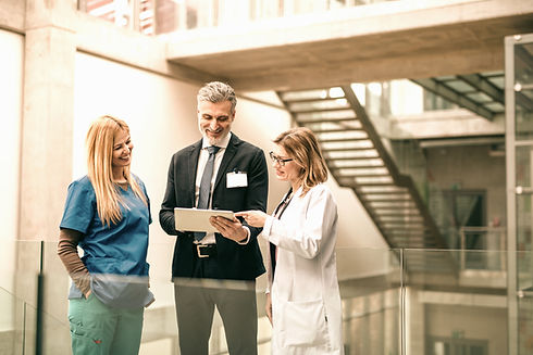 Group of doctors talking to pharmaceutical sales representative._edited.jpg