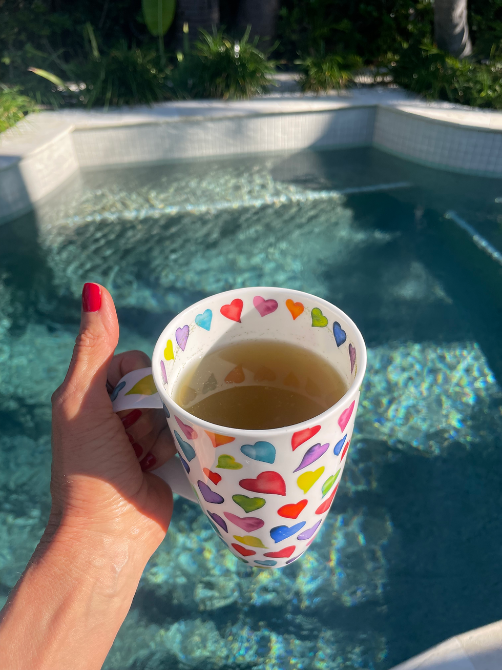 Enjoying a delicious cup of tea, poolside, between meetings.