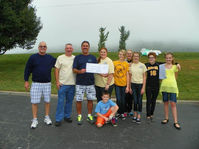 photo of cleanup with hayes volleyball team on riverbank.jpg